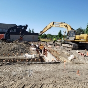 Valley park branch construction outside pictured with workers and machinery 