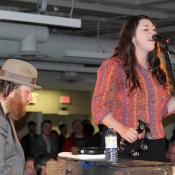 man playing the piano and female singing