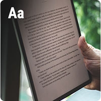 A tablet with text on it and the characters "Aa" in the top right